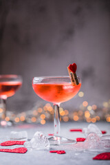 Festive pink cocktail with champagne or prosecco  for St. Valentine's day. Couple of glasses