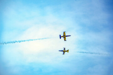 Airplanes on airshow. Aerobatic team performs flight at air show