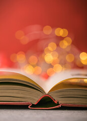 Book with lights on red background. Romantic Valentine  concept