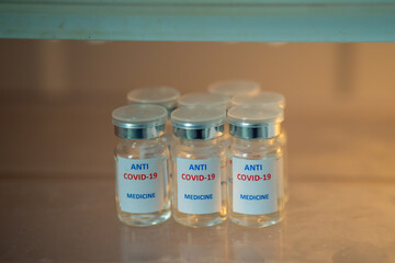 Anti COVID-19 medicine in glass bottles. COVID-19 corona virus prevention and treatment concept.