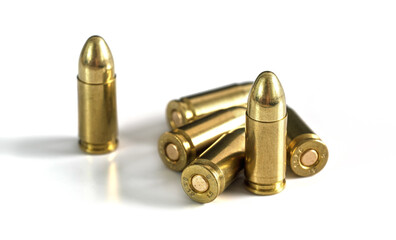 Yellow brass ammo bullets isolated on white background - obrazy, fototapety, plakaty