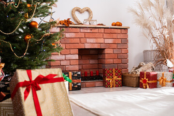 Christmas tree decorated with golden baubles and a chain. Christian holidays. A warmly decorated...