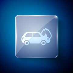 White Burning car icon isolated on blue background. Car on fire. Broken auto covered with fire and smoke. Square glass panels. Vector.