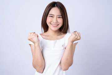 Fototapeta na wymiar Asian woman poses with a feeling of excitement and joy, Isolated on white background.
