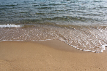 Soft beautiful ocean wave on sandy beach. Background