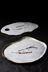 Handmade Ceramic Plates and Trays. Handcrafted with Traditional Ottoman Pattern on Dark Surface and Backround. Handicraft.