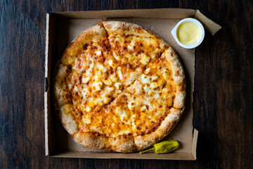 Take Away Pizza Quattro Formaggi Four Cheese Pizza in Box.