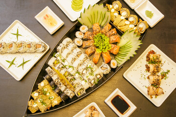 Beautiful and delicious varied sushi rolls on a stone board oporto portugal 