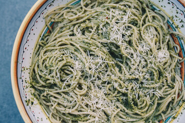 Pasta with pesto in italian bowl