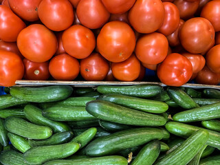 Red tomatoes and green cucumbers on the market. Netanya, Israel