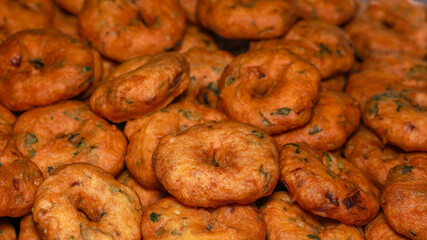 Close up shot of South Indian snack many spicy vada's 
