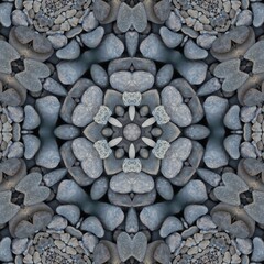 kaleidoscopic style of pebbles on a beach with colourful child's play fork and rake