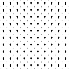 Square seamless background pattern from black lamp symbols are different sizes and opacity. The pattern is evenly filled. Vector illustration on white background