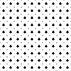 Square seamless background pattern from black clubs are different sizes and opacity. The pattern is evenly filled. Vector illustration on white background