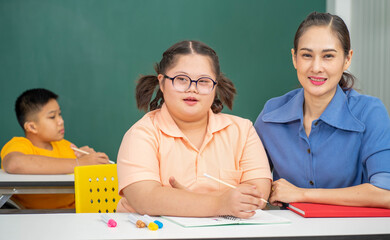 Asian disability child and Autism kid in special classroom with teacher