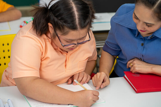 Asian disability child and Autism kid in special classroom with teacher