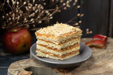 a piece of apple cake on wooden board