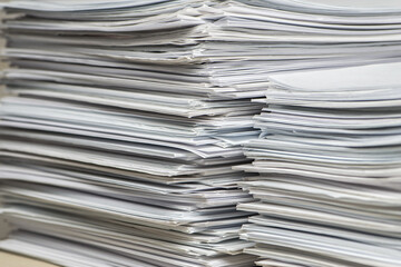 bundles bales of paper documents. stacks packs pile on the desk in the office