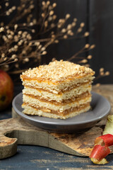 a piece of apple cake on wooden board