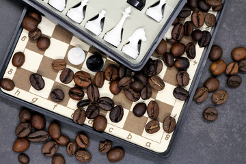 coffee beans and a chessboard so close, top view