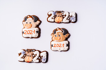 Christmas gingerbread in the shape of bull on white background.