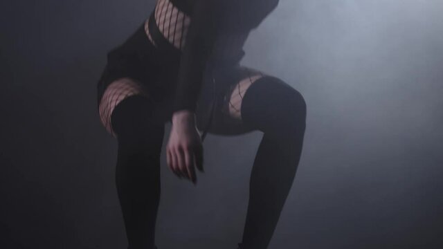 Vogue - young attractive woman gets up from her crouch