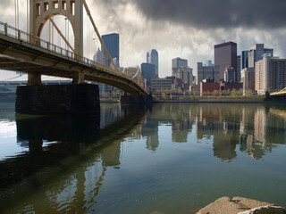 Old river bridge with storm sky in downtown Pittsburgh Pennsylvania.