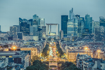 Obraz premium View of La Defence Paris business district from Place Charles De Gaulle at dusk.