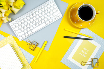 2021 colors of the year, yellow and gray, desktop workspace with keyboard and desk accessories. Top...