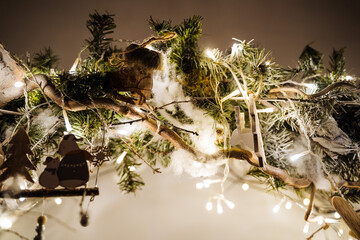 small lights garlands hanging on a white wall, taken in the evening, close-up, macro photography
