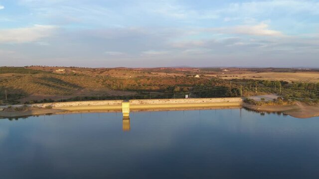 Drone aerial view of a dam lake reservoir landscape in Terena, Portugal