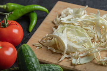 Mixed vegetables ready to cook on black background