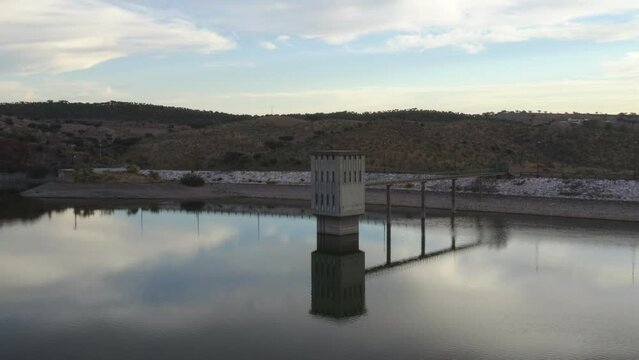 Drone aerial view of a dam lake reservoir landscape in Terena, Portugal