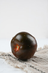 Black tomato - Kumato on the white background