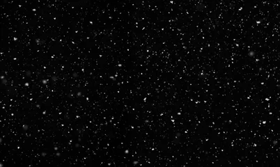 Fallender Schnee auf schwarzem Hintergrund isoliert © lumikk555