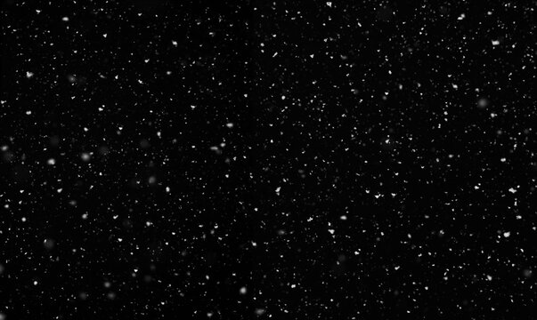 Falling snow isolated on black background