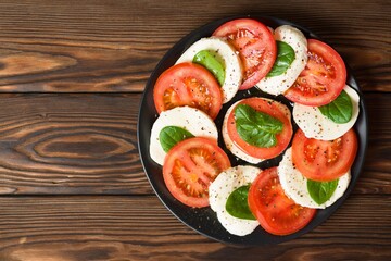 Italian caprese salad on a round plate