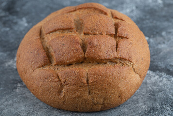 Baked bread on grey background. Bakery and grocery food store concept.