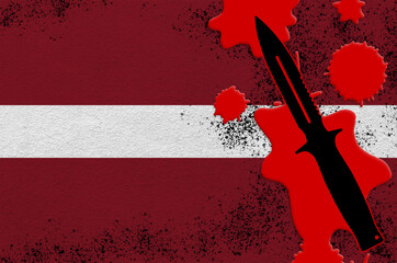 Latvia flag and black tactical knife in red blood. Concept for terror attack or military operations...