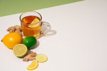 Hot herbal tea with ginger, lemon and honey vitamins C over grey background. Concept alternative medicine, natural homemade remedy for cold and flu. Support the immune system. Well-Being and Healty