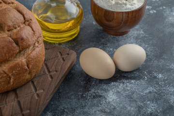 Fototapeta na wymiar Homemade rye bread with egg and oil