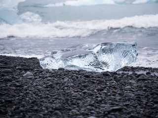 Echoed iceberg on the "Diamond Beach", at the entry of the Jökulsárlón Glacier Lagoon