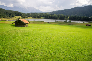 hut on meadows by Geroldsee lake, Bavarian Alps, Germany