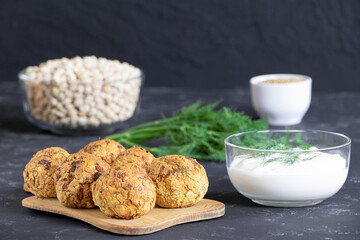 Fresh vegetarian food. Vegetarian baked falafel with sauce. Falafel balls. Chickpea and onion. Helthy food.