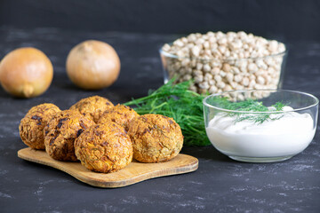 Fresh vegetarian food. Vegetarian baked falafel with sauce. Falafel balls. Chickpea and onion. Helthy food.