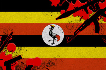 Uganda flag and various weapons in red blood. Concept for terror attack and military operations...