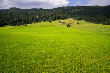 hut on meadows by Geroldsee lake, Bavarian Alps, Germany