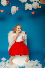 Little cute girl angels on a blue background for Valentine's Day