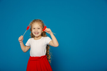 Little cute girl with fidget on Valentine's Day