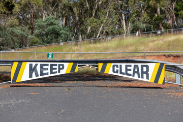 A safety keep clear boom gate on a road
